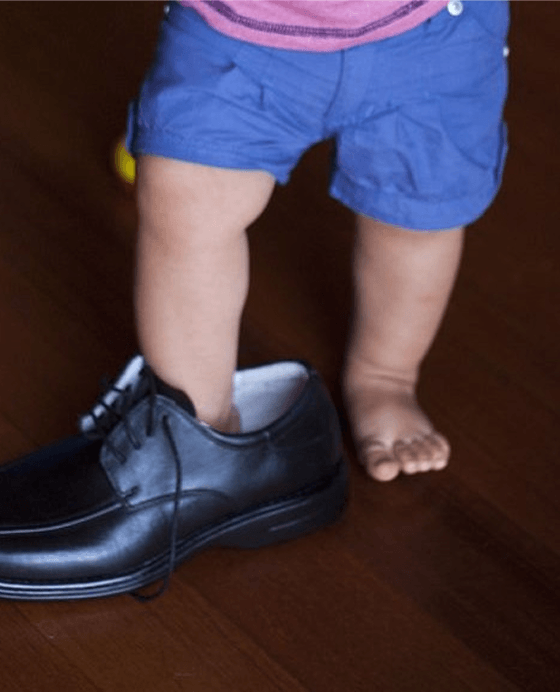 Dad's shoes feel enormous.