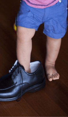 Dad's shoes feel enormous.